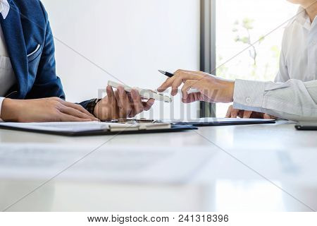 Businessman Being Analysis And Making The Decision A Car Insurance Policy, Agent Man Is Holding The 