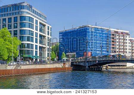 Berlin, Germany - April 22, 2018: River Spree And Its Bank Schiffbauerdamm, Modern Building  With Th