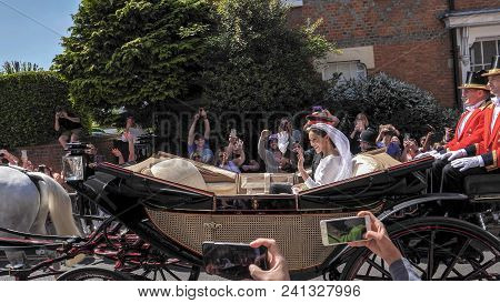Windsor, England - May 19 2018: Prince Harry, Duke Of Sussex And Meghan, Duchess Of Sussex Leave Win