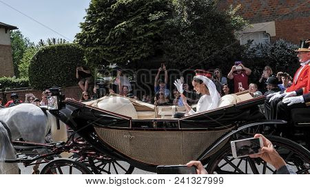 Windsor, England - May 19 2018: Prince Harry, Duke Of Sussex And Meghan, Duchess Of Sussex Leave Win