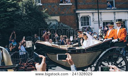 Windsor, England - May 19 2018: Prince Harry, Duke Of Sussex And Meghan, Duchess Of Sussex Leave Win