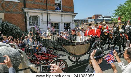 Windsor, England - May 19 2018: Prince Harry, Duke Of Sussex And Meghan, Duchess Of Sussex Leave Win