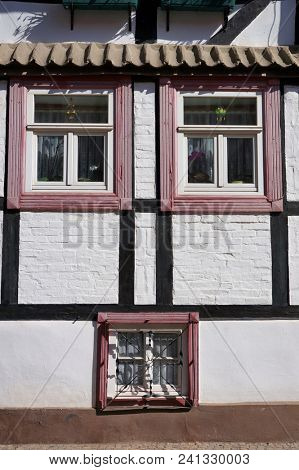  Windows on facade of old medieval building in Quedlinburg, Germany.                   