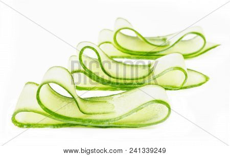 Three Cucumber Slises Isolated On White Background
