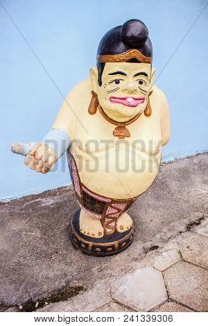 Traditional Indonesia Cement Statue. Semar Character Of Wayang, Indonesia Culture. Statue With Welco