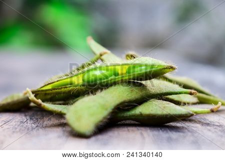 Pile Up Of Boiled Green Edamame Or Soybean On The Wood