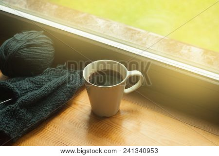 Coffee Cup And Handmade Work Knitting On A Sunny Day Window Background, Toned Photo