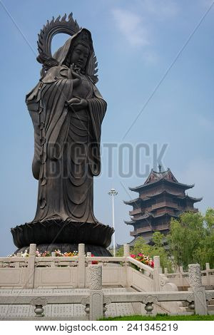 Statue And Tower At Guiyuan Buddhist Temple In Wuhan Hubei China Poster Id