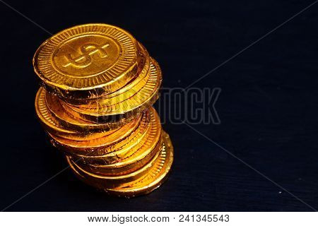 Heap Of Gold Coin With Dollar Currency Write On It. Gold Coin On Black Background
