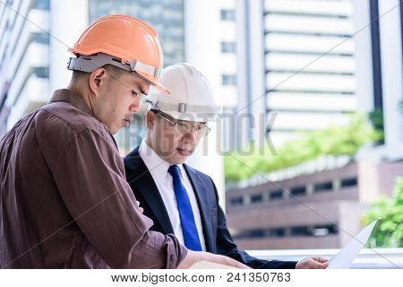 Two Asian Business And Engineer Man Has Planning And Working For Design Buiding And City.