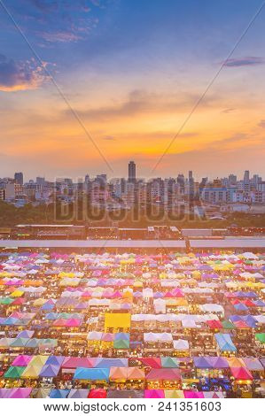 Aerial View Multiple Colour Flea Market With After Sunset Sky Background With City Building Business