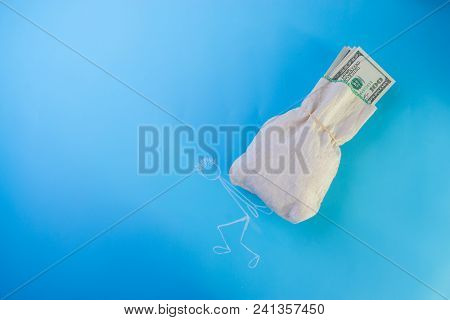 Businessman Carrying Bag Of Dollars