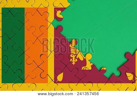 Sri Lanka Flag  Is Depicted On A Completed Jigsaw Puzzle With Free Green Copy Space On The Right Sid