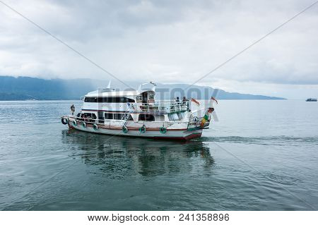 Lake Toba Is A Large Natural Lake Occupying The Caldera Of A Supervolcano, Located In The Middle Of 