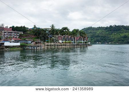 Lake Toba Is A Large Natural Lake Occupying The Caldera Of A Supervolcano, Located In The Middle Of 