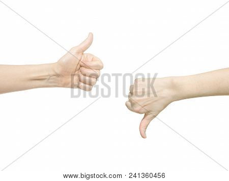 Closeup Of Two Female Hands Showing Thumb Up And Down Signs Against White Background. Isolared Commu