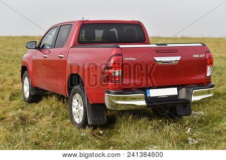 Slany, Czech Republic - November 10, 2016: Red Toyota Hilux In Slany, Czech Republic, November 10, 2