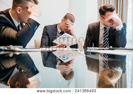 Business Failure. Prospective Bankruptcy. Stressed Stunned Crushed Defeated Team Of Company Executiv