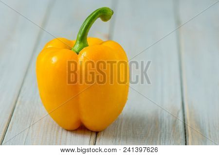 Sweet Yellow Peppers On Rustic White Wood Kitchen Table