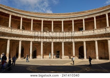 People Visiting Courtyard In Palacio De Carlos V In La Alhambra, Granada, Spain