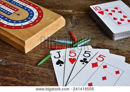 A Close Up Image Of A Winning Card Hand In A Game Of Cribbage.