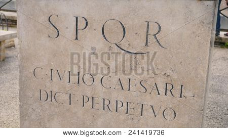 Roman Writing And Bas-reliefs Imperial Era Archeology Italy. Stock. Spqr Inscription On The Wall.