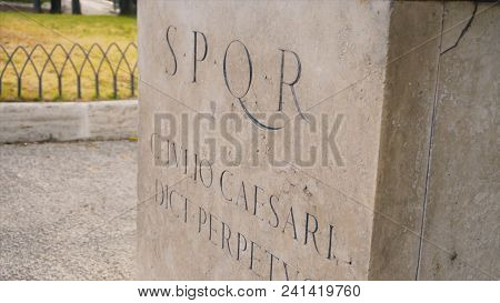 Roman Writing And Bas-reliefs Imperial Era Archeology Italy. Stock. Spqr Inscription On The Wall.