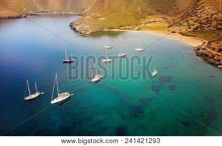 View From Above Of A Beautiful Golf In Cyclades, Greece. Sailing Boats On Turquoise Water On Fikiada
