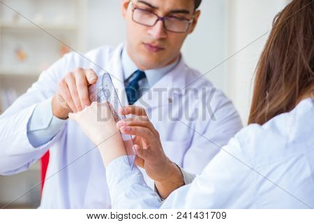 Doctor checking patients joint flexibility with gonimeter