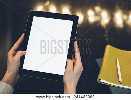 Closeup Of A Woman Pointing Finger To An Blank Display Of The Tablet With A Blue Color In A Homelike