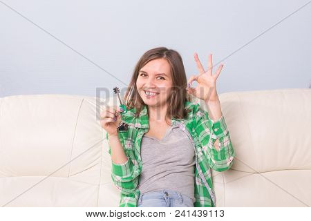 Young Woman With Boxes And Holding Flat Keys