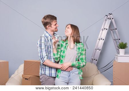 Happy Woman In Her New Home Holding Key