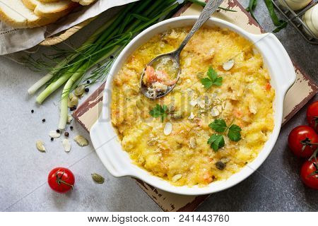 Casserole Crumble With Red Fish, White Bread And Cheese On Stone Or Slate Background. Proper Nutriti