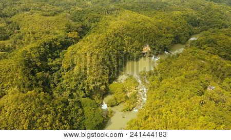 Aerial View, River In The Rainforest Among The Jungle Tropical Loboc River In The Rain Forest In Asi