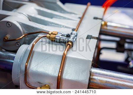 Fragment Of The Hydraulic System Of The Press Machine. Thin Copper Tubes Are Connected By A Metal Te