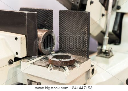 Automatic Bandsaw Sawing Metal Workpiece. Equipment For Cutting Metal Pipes And Other Steel Blanks.