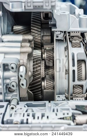 The Inner Structure Of The Automotive Gearbox. Visible Helical Gears And Wheels.