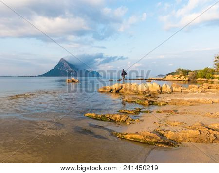 San Teodoro, Sardinia Italy - May 8 2018: Beautiful Shallow Blue Water Bay Overlooking Isola Tavara 