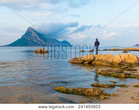 San Teodoro, Sardinia Italy - May 8 2018: Beautiful Shallow Blue Water Bay Overlooking Isola Tavara 