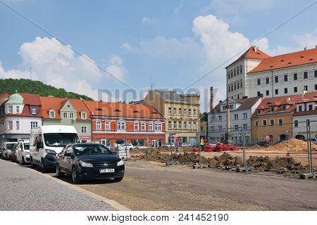 Bilina, Czech Republic - May 12, 2018: Cars And Historical Houses On Mirove Namesti Square During Ge