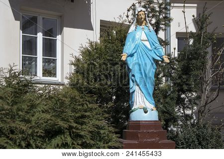 Old Woman Maintaining Chapel In Praga District Of Warsaw, Poland.