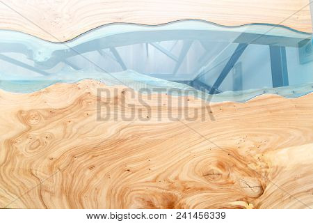 Texture Of A Wooden Table With Epoxy Resin. Top View Of Wood For Background.