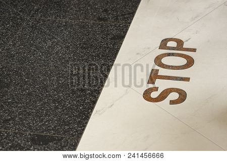 Stop Sign On The Line On The Floor. Concept: Stop Line, Deadline