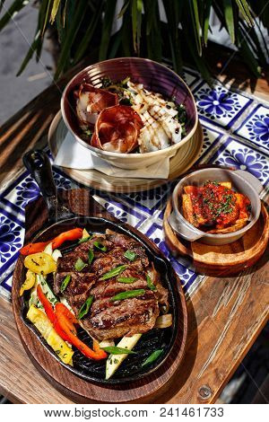 Sunlit Juicy Meal At Mexican Restaurant, Vertical, Palm Leafs And Mecican Tiles As Background