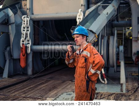 Marine Deck Officer Or Chief Mate On Deck Of Marine Vessel Or Ship , Wearing Ppe Personal Protective