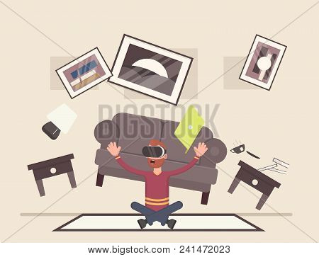The Guy Is Sitting And Playing In The Room In Virtual Reality. Vector Illustration In Cartoon Style