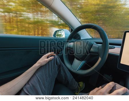 Person Using A Car In Autopilot Mode Hands Free
