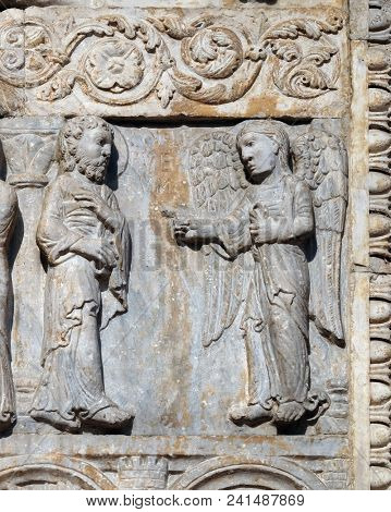 VERONA, ITALY - MAY 27: Angel appeared to Joseph in a dream to tell him to flee to Egypt, medieval relief on the facade of Basilica of San Zeno in Verona, Italy, on May 27, 2017.