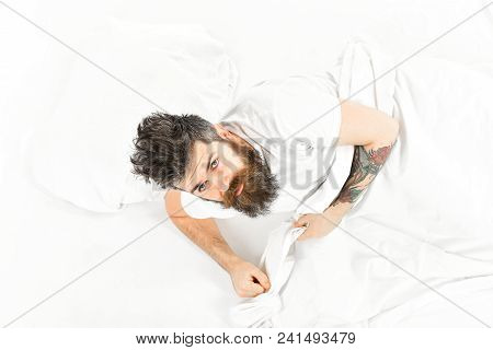 Man With Sleepy Face Get Up On Bed, White Sheets, Top View. Hipster With Beard And Mustache Waking U