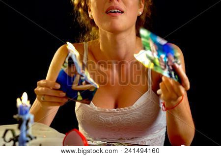 Wedding memories. Broken heart woman. Couple break up. Sad bride on unhappy wedding. Woman and groom quarrel. Portrait crying female. Family has divorce. Destruction of archives.